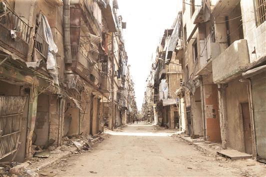 مباني متضررة في منطقة تسيطر القوات السورية عليها في حلب في 21 ايار الحالي (ا ف ب)