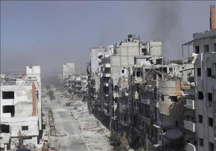 مبان مدمرة في حمص امس الاول (رويترز) 