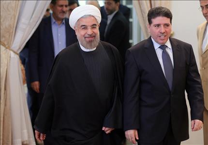 روحاني خلال استقباله الحلقي في طهران امس (ا ف ب) 