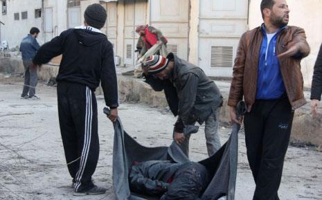 الكشف عن عشرات جثث المعارضين الذين أعدمتهم "الدولة الاسلامية" في حلب أمس (أ ف ب)